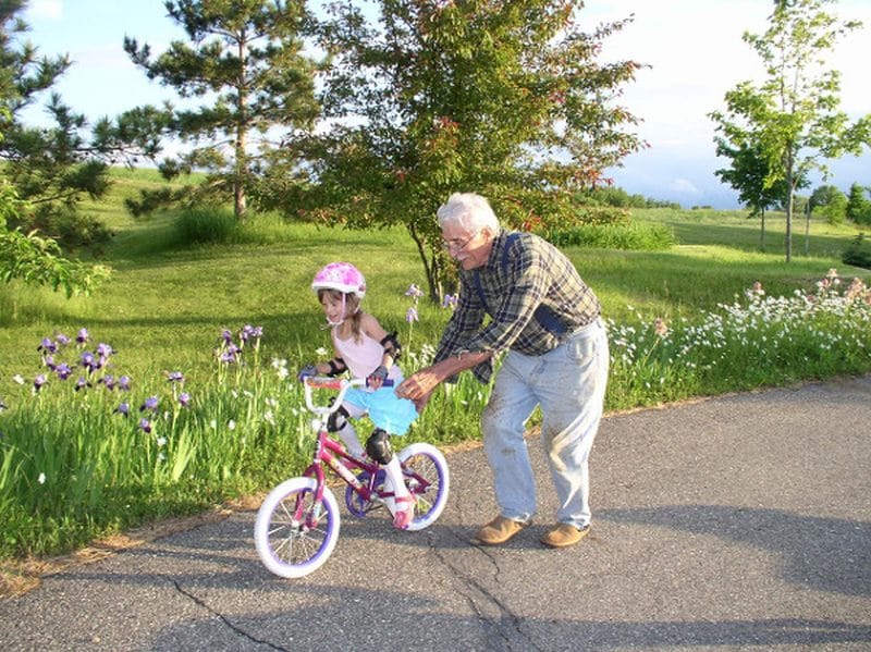 child-learns-bike-ride-without-training-wheels-petit-early-learning-journey