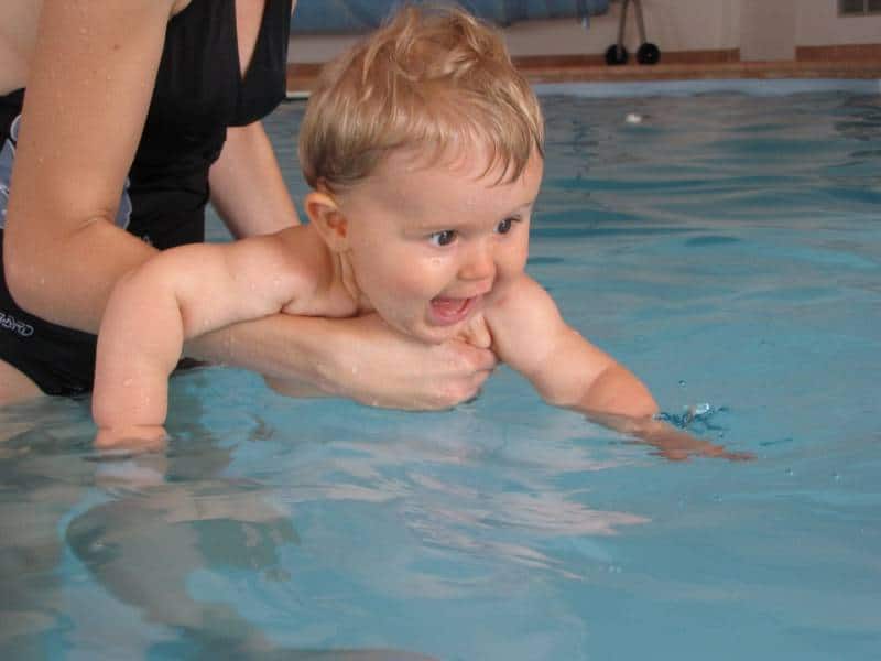 Mum and child at baby swimming lessons